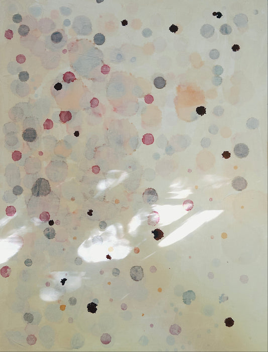 Translucent polka dot pattern on a light background